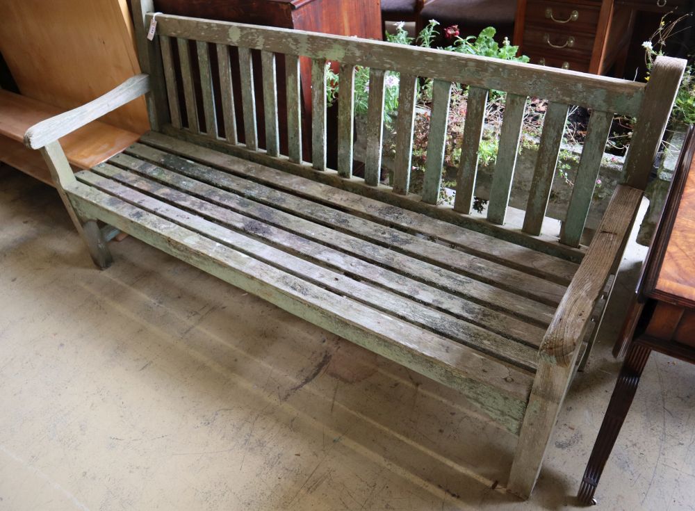 A weathered teak garden bench, length 79cm depth 60cm height 90cm